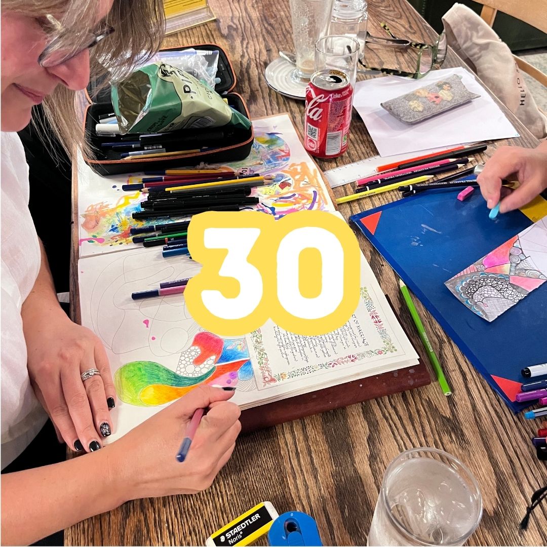 photo of a lady drawing representing 30 adult workshops