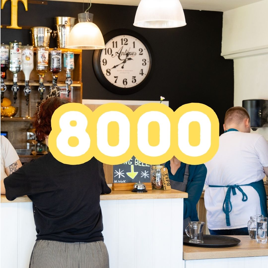 photo of staff serving drinks in the café representing the 8000 cups of tea we serve