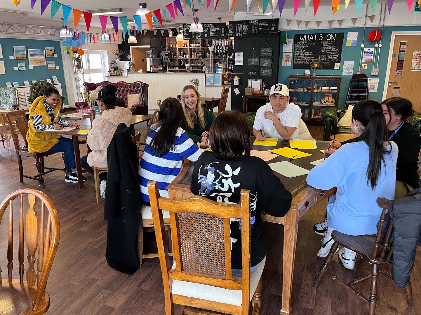 Young people sat around a table getting crafty! 